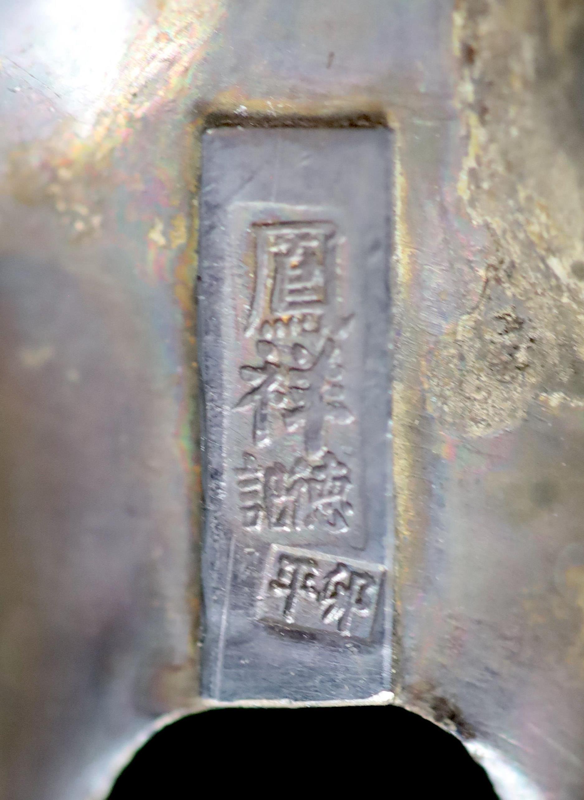 A Chinese white metal model of a boy riding a qilin , early 20th century, 12.5cm long